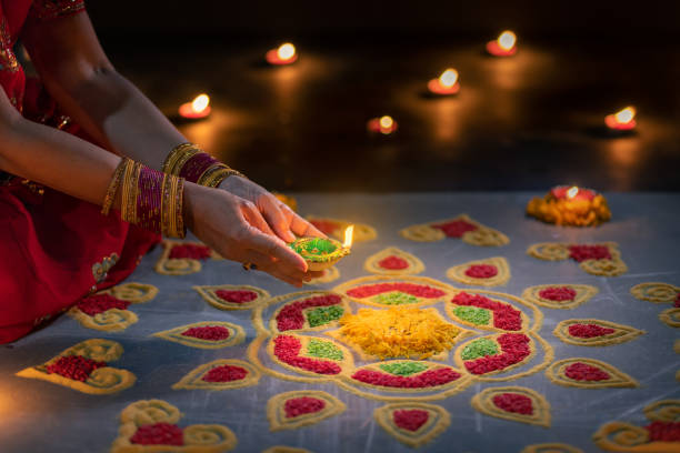 istock Happy Diwali - Diya lamps lit during diwali celebration 1434884089