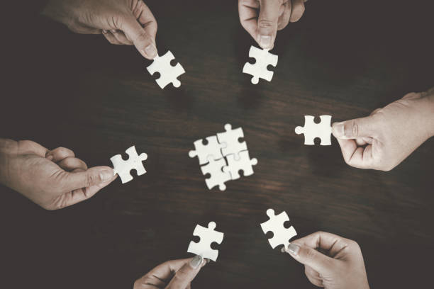 istock Business group connect pieces of puzzle think of problem solving. Brainstorm, decision concept. 1434884345
