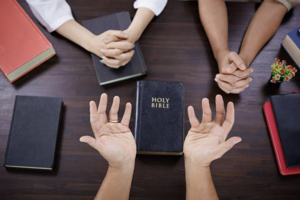 istock Asian Christian groups sitting within the Church Catholic prayed for blessings from God. A pale sun shone in a place of worship.Religious concepts. 1434884943