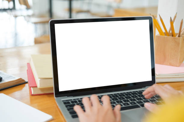istock Close up of woman studying online using laptop with blank screen. 1434893588
