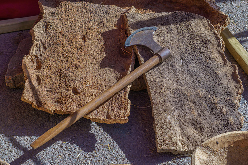 plates of natural cork and axe used for its extraction