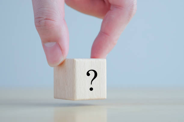 istock Hand holding question mark symbol on wooden block with copy space. Ask, FAQ, Advice, Support, Problem and solution concept. 1434903612