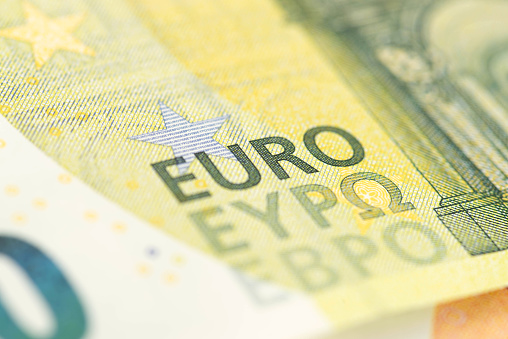 Fragment of a twenty euro banknote close-up with word EURO.