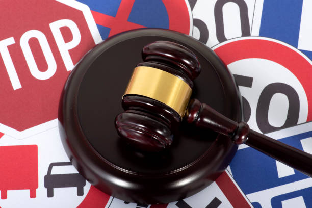 Traffic signs and a judge's hammer