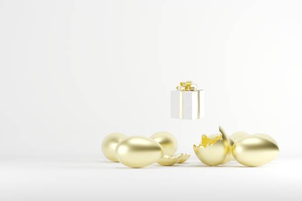 istock White Gift box  out of golden Egg on White background. 3D Render. Minimal Christmas idea concept. copy space. 1434908127