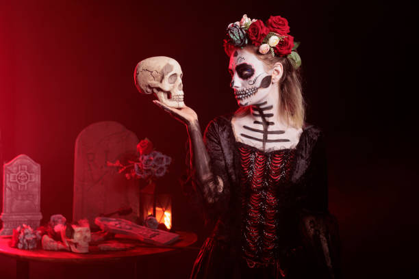 istock Spooky goddess of death looking at skull 1434909700