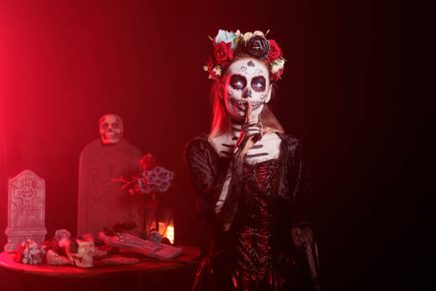istock Santa muerte model showing mute confidential sign 1434910070