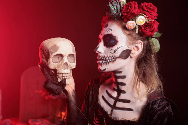 istock Creepy goddess holding skull and black rose 1434910514