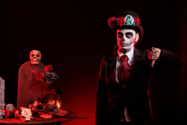 istock Spooky lady with skull make up giving thumbs down 1434910569