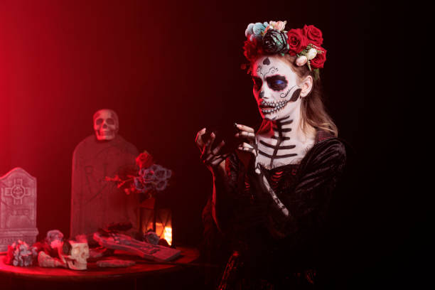 istock Santa muerte model playing video games on smartphone 1434911519