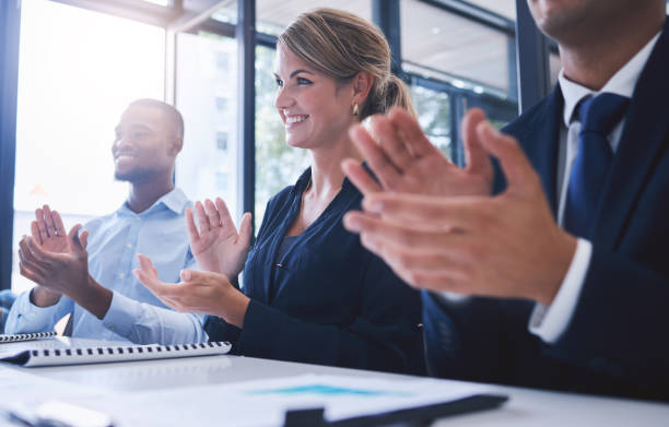 istock Teamwork training, workshop and clapping team in presentation, business meeting or office tradeshow. Diversity employees, motivation or people success for innovation or company education with paper 1434912928