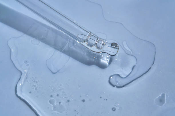 istock Dropper with serum or cosmetic oil on a blue background. 1434913231