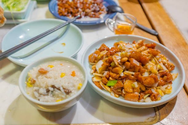 blurry defocused image of fried chicken stir fry with cashew nut , sweet pepper, onion for background