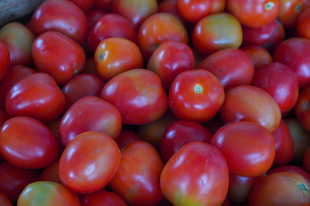 Bright red tomatoes are delicious in a variety of dishes. On the chalkboard in the kitchen