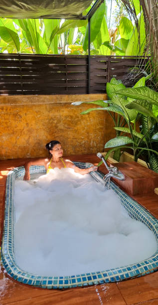 istock Women in a bath in a tropical garden 1434917445