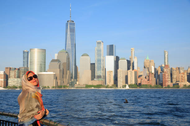 Pretty active women wears a headscarf enjoying in Panorama of New York City skyline Lower Manhattan Pretty active women wears a headscarf enjoying in Panorama of New York City skyline Lower Manhattan and the Freedom Tower Panoramic new york marathon photos stock pictures, royalty-free photos & images