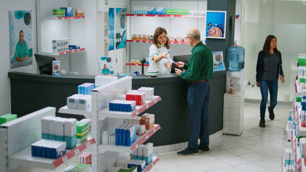 istock Elderly client asking pharmacist about pills for prescription treatment 1434921763
