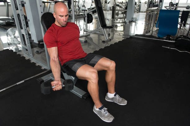 istock Man With Dumbbells Exercising Biceps 1434924095