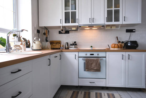 istock White cozy kitchen in Scandi loft style. Home interior, dining room design, oven, hob, table, kitchen furniture 1434925669