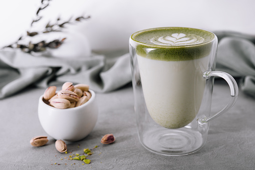 Green matcha latte with pistachios