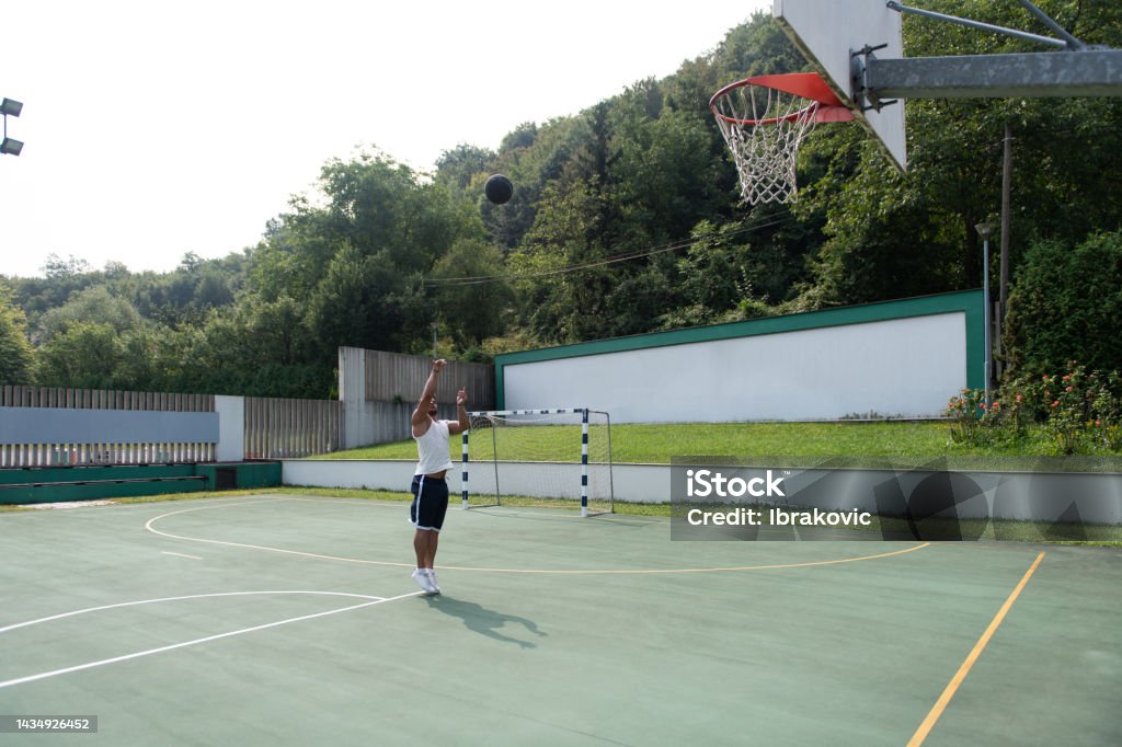 Bodybuilder Basketball Player Is About To Slam Dunk Stock Photo