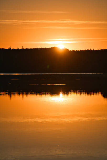 istock Sunset with reflection on a Swedish lake in Smalland. Romantic evening mood 1434928668