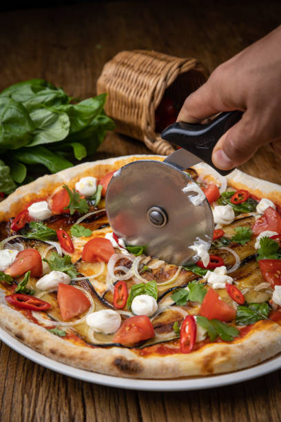 istock pizza with eggplant, cheese, tomatoes and chili peppers in a restaurant 1434929309