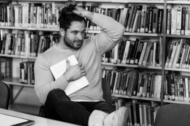 Young Man Student Feel Bored While Trying to Studying Entry Exams to University or College