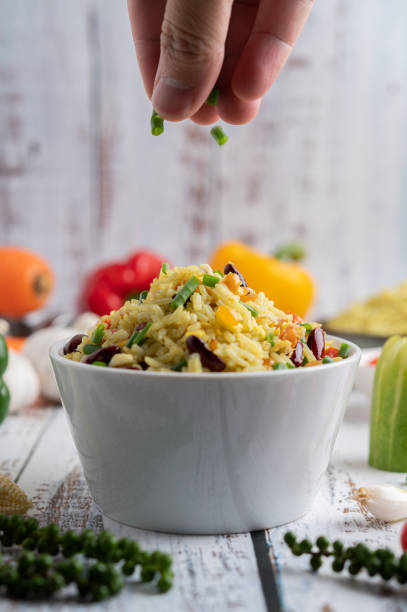 istock Mixed fried rice in a cup on a white wooden floor 1434931375