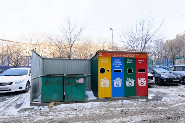 Garbage bins of different colors for separate collection of garbage. stock photo