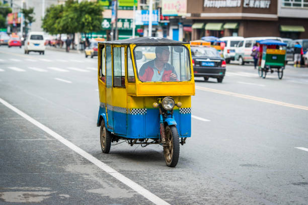 Auto rickshaw on the city road. stock photo