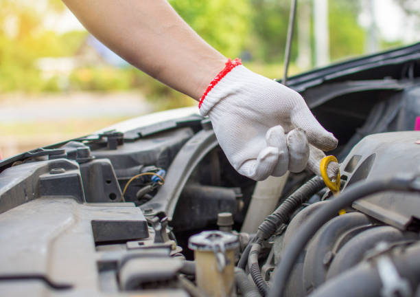 istock Mechanic's hands check or fix the engine oil check point of the engine. 1434937828