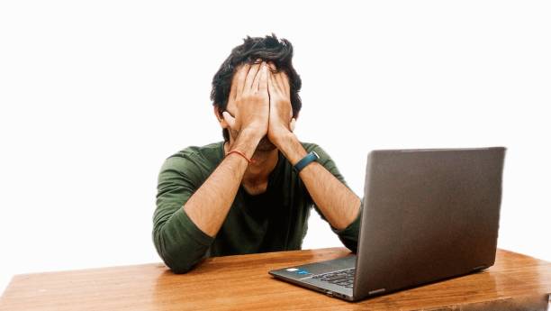 Businessman Holding His Head And Feeling Stressed by loss Businessman Holding His Head And Feeling Stressed by loss In Business. facepalm stock pictures, royalty-free photos & images