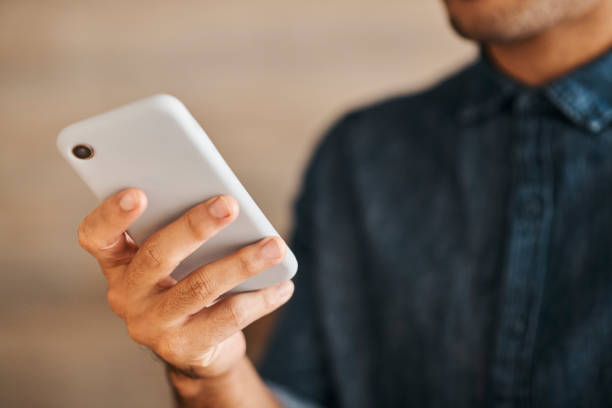 istock Phone, networking and communication with a hand of a woman typing an email or send a text message. Zoom in of 5g mobile technology to contact us, for social media and to access the internet or web 1434941156