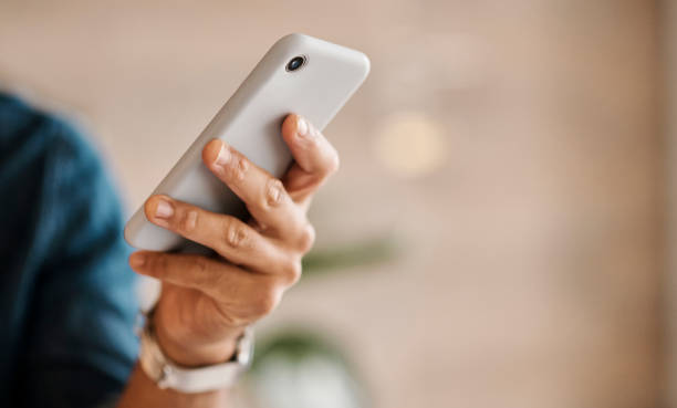 istock Business, hands and phone texting for communication, wifi or internet against a blurred background. Hand of employee chatting on mobile smartphone mockup in social media or conversation at the office 1434941221