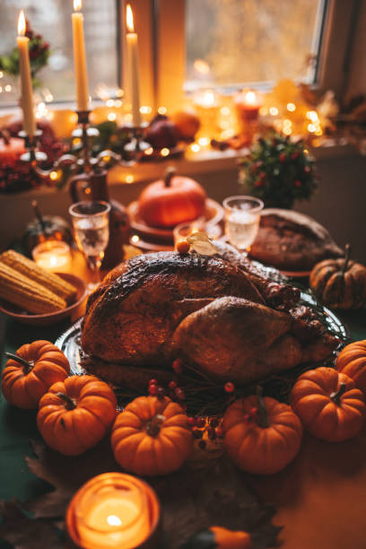 istock Thanksgiving holiday dinner table setting with fall decoration and pumpkins 1434945782
