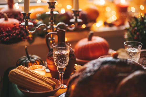 istock Thanksgiving holiday dinner table setting with fall decoration and pumpkins 1434945783