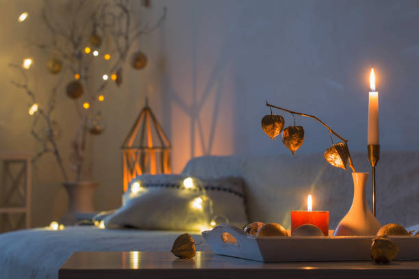 christmas home decorations with candles in white interior