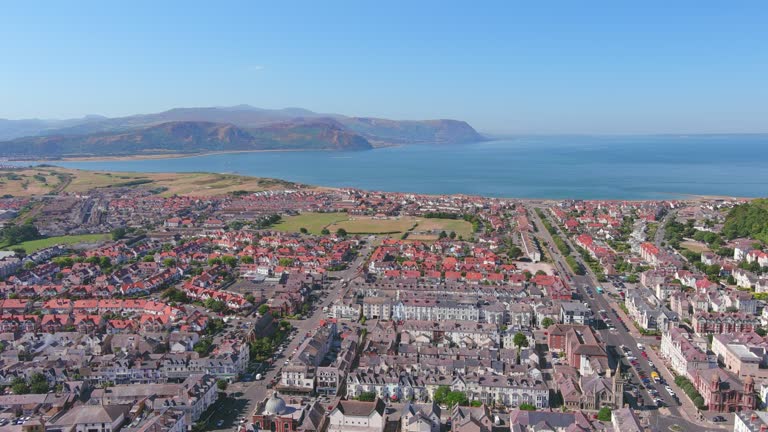 Llandudno, UK: Aerial view of city in Wales, famous seaside resort, blue waters of Atlantic Ocean in summer, sunny day, clear blue sky - landscape panorama of United Kingdom from above