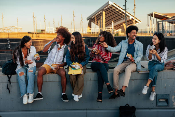 istock Excited students lunch outdoors. 1434948067
