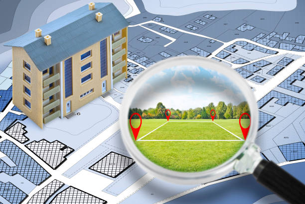 Land management with an imaginary cadastral map of territory with a vacant land available for sale or building construction - Concept seen through a magnifying glass Land management with an imaginary cadastral map of territory with a vacant land available for sale or building construction - Concept seen through a magnifying glass planning zoning stock pictures, royalty-free photos & images