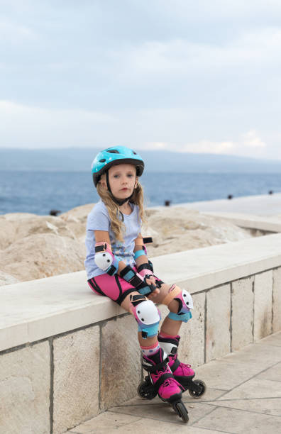 istock The child is resting after rollerblading along the embankment. 1434949806