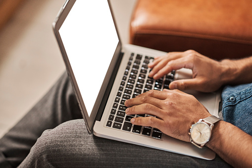 Businessman hands, laptop mockup and typing, planning email and digital marketing in office lounge. Closeup employee keyboard screen, online research and internet website connection on tech analytics