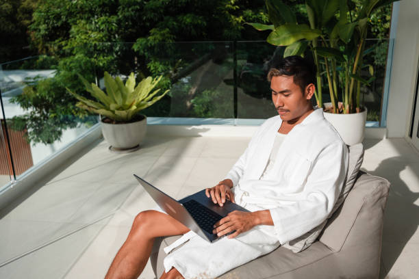 istock Young man is working remotely on his travel 1434951917