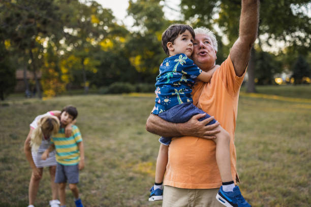 istock Multi-generation family having fun in a public park 1434952177