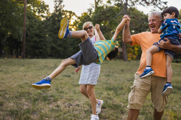 istock Multi-generation family having fun in a public park 1434952360