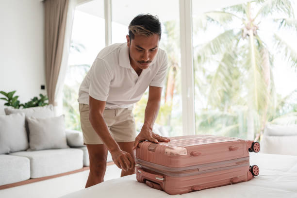 istock Man is packing luggage for vacation 1434952513