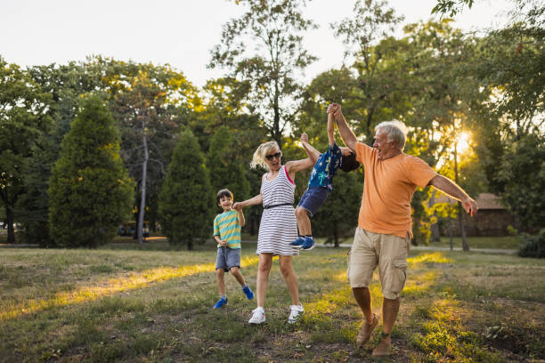 istock Multi-generation family having fun in a public park 1434952596