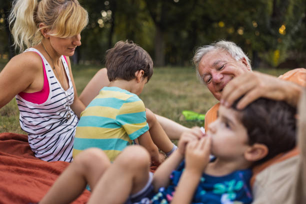 istock A multi-generation family lying on a blanket in a public park 1434953009