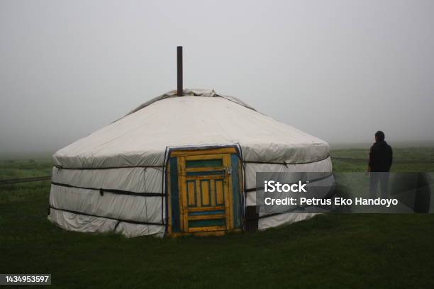 Nomadic Tent And A Woman In The Mist Of The Tranquil Meadow Khuvsgul Mongolia Stock Photo - Download Image Now